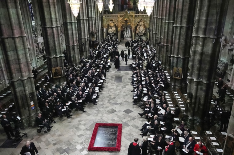 Image: Guests and officials begin to take their places prior to the coffin of Queen Elizabeth II being carried into Westminster Abbey for her funeral in London, on Sept. 19, 2022.