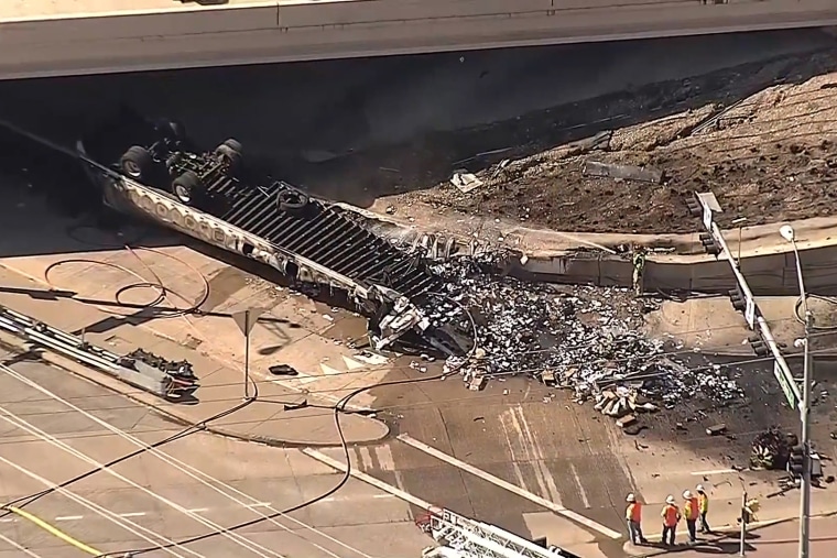 The aftermath of an 18-wheeler crash after it burst into flames as it fell onto the service road below, according to authorities and witnesses.