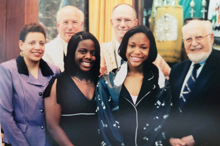 Brennan Nevada Johnson, center right, at her bat mitzvah. Her mom, Tina M. Johnson, PhD, and sister Jaren N. Johnson are on the left. At the far right is the late ritual director Edward O. Adler. In the back are Rabbis Wayne Franklin and Alvan Kaunfer.