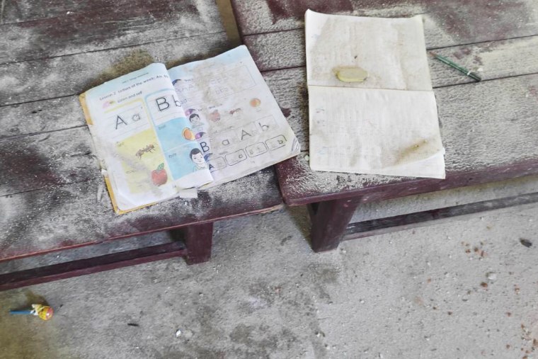 Damaged books lie on the floor of a school in the Myanmar village of Let Yet Kone on Saturday, the day after it was hit by an airstrike. 