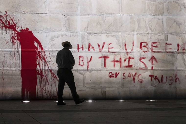 Image: Washington Monument Vandalized With Suspect In Custody