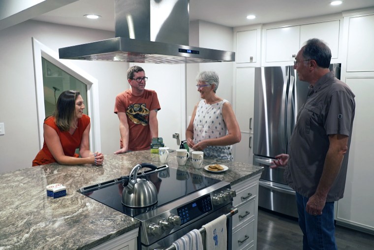 Kathryn Teske, left, and her family in their kitchen in Spokane, Wash., on Aug. 29.