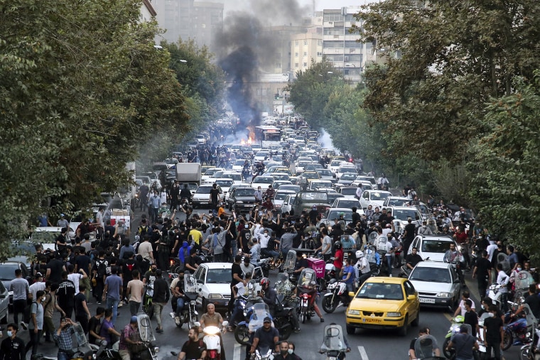 People protest over the death of a woman who was detained by the morality police in downtown Tehran, Iran, on Sept. 21, 2022.