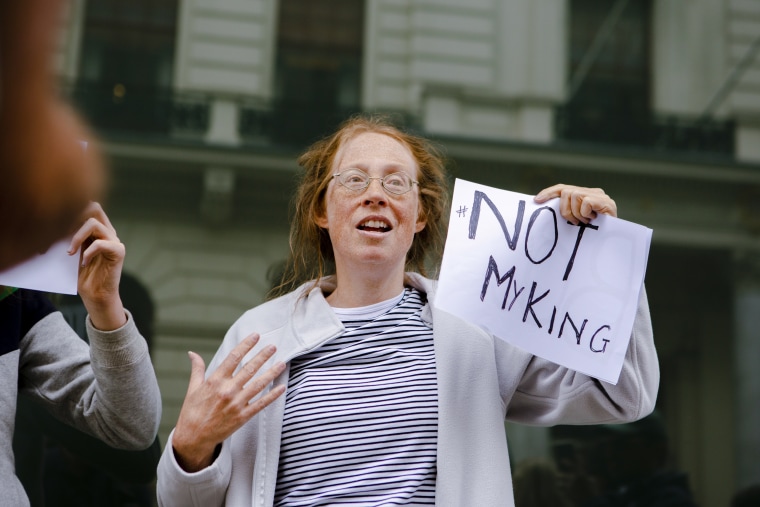 A protester holds a "Not my king" sign outside St. James's Palace as King Charles III is proclaimed the new monarch.