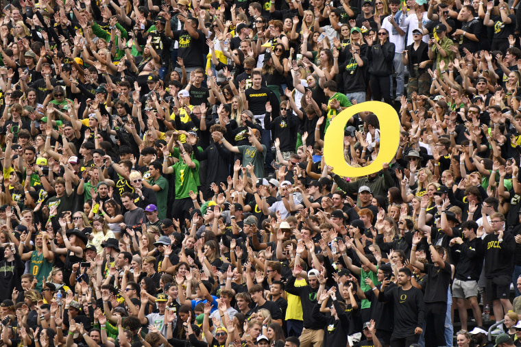 Oregon students and fans cheer the during the first half of the game against Brigham Young in Eugene, Ore., on Saturday.