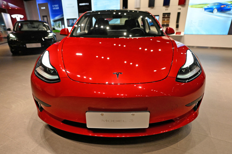 A Tesla Model 3 in a showroom.