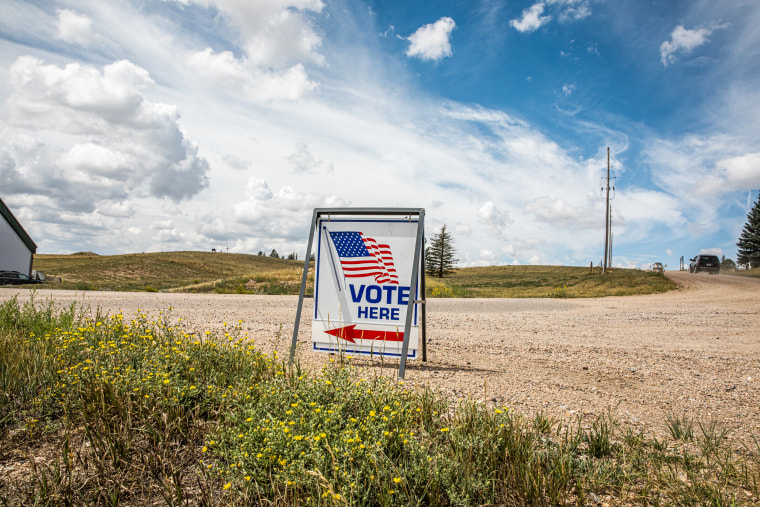 A "Vote Here" sign outside a polling location in Cheyenne, Wyo., on Aug. 16, 2022.