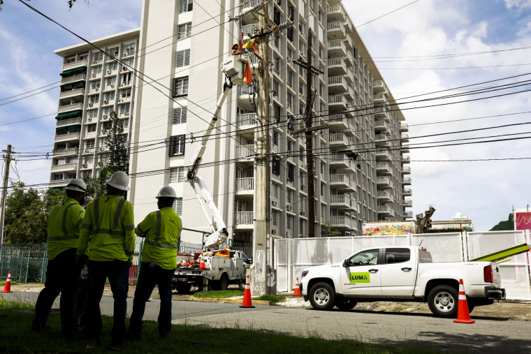 Image: Members of the company LUMA work restoring energy on Sept. 20, 2022 in San Juan, Puerto Rico.