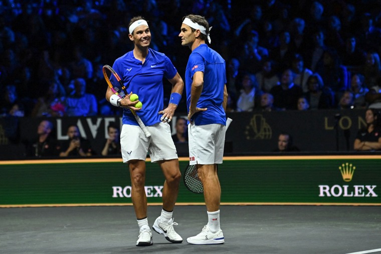 Image: Roger Federer of Switzerland, right, talks to Team Europe's Rafael Nadal of Spain, left, playing against USA's Jack Sock and Team World's Frances Tiafoe during their men's doubles tennis match from the 2022 Laver Cup at the O2 Arena in London on September 23, 2022.