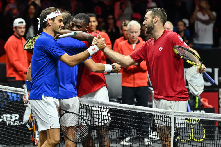 Image: Roger Federer of Switzerland, left, playing with Team Europe's Rafael Nadal of Spain, shakes hands with Team World's American Jack Sock, right, after their men's doubles tennis match in the 2022 Laver Cup at the O2 Arena in London early on September 24.  2022.