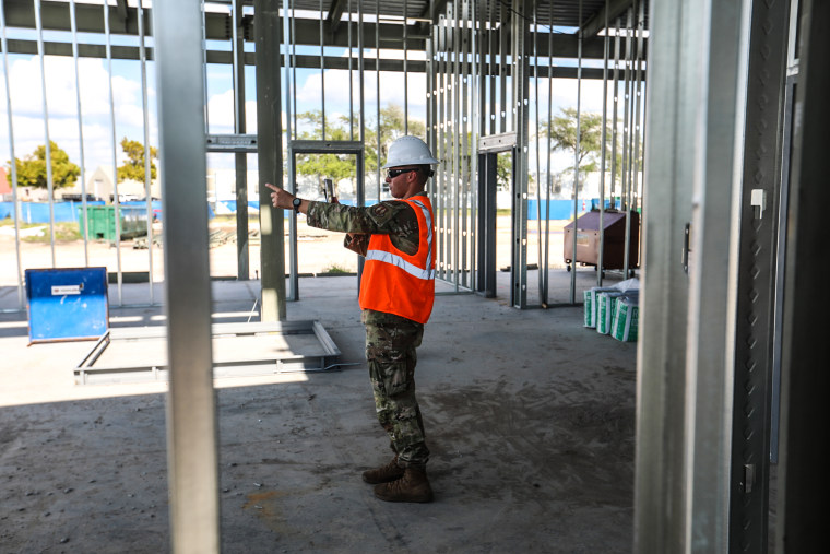 Lt. Nicholas Cap, Natural Disaster Recover Division, USAF, shows digital twin thought augmented reality at new headquarters building.