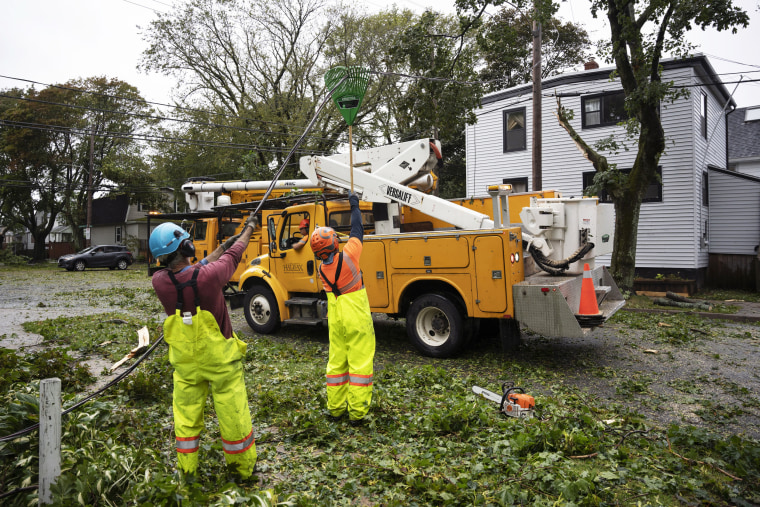 People work to access fallen trees caused by post tropical storm Fiona
