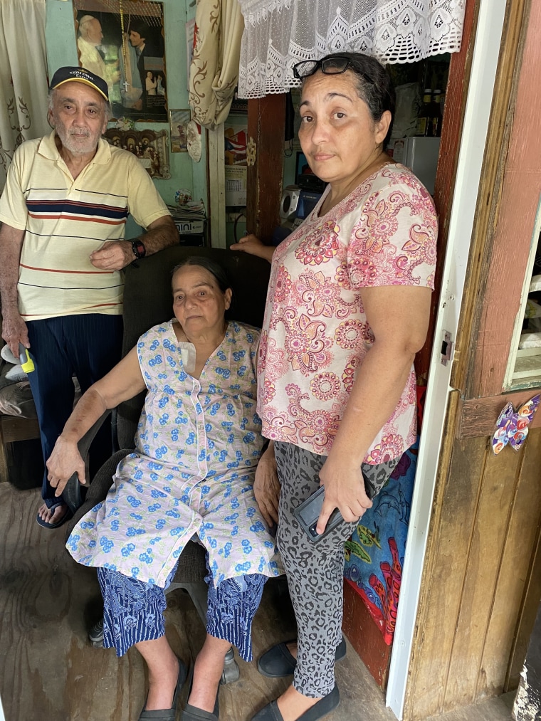 Carmen Cruz Vázquez, right, with her parents, Carmen Vázquez Ramos and Juan Cruz Camacho, in their home in San Germán, Puerto Rico.