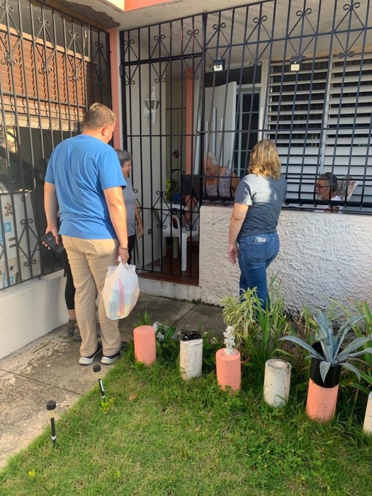 Hevel Velez Luciano distributes food and supplies in Cabo Rojo, Puerto Rico, September 24, 2022.