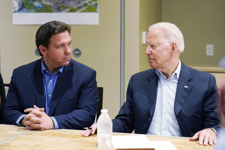 Image: President Joe Biden and Florida Gov. Ron DeSantis, left, during a briefing with first responders and local officials in Miami on the condo tower that collapsed in Surfside, Fla., on July 1, 2021.