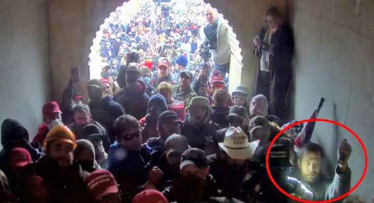 Kyle Young, lower right, in the tunnel at the Capitol on Jan. 6, 2021.