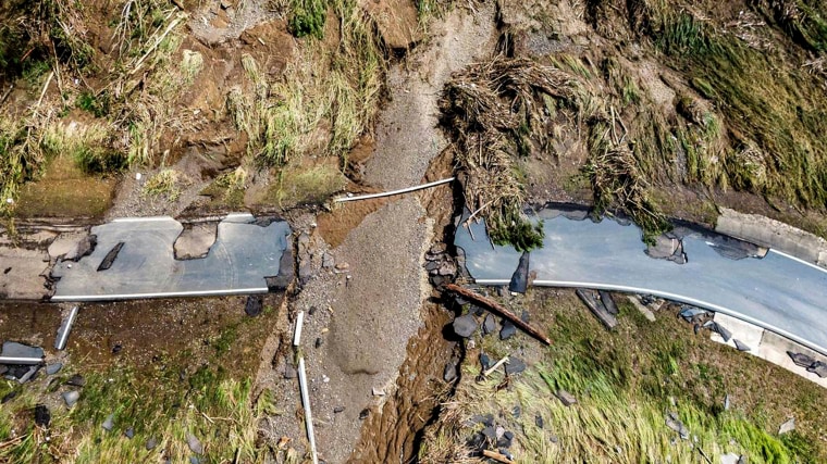 Road bisected by flood debris.