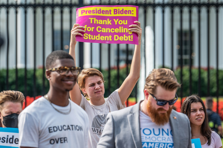 Student loan debt activists rally outside the White House a day after President Biden announced a plan that would cancel $10,000 in student loan debt for those making less than $125,000 a year in on Aug. 25, 2022.