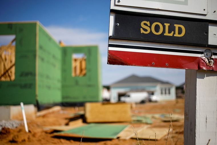 A "Sold" sign outside a house under construction in Louisville, Ky., on July 1, 2022.