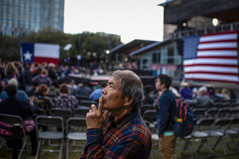 A supporter waits for Presidential hopeful Massachusetts Senator Elizabeth Warren to speak during a townhall in Houston, Texas on Feb. 29, 2020