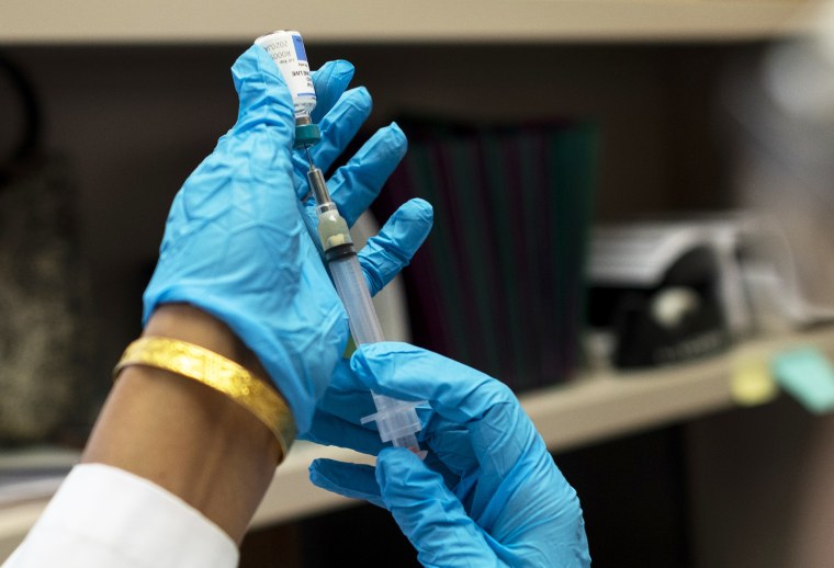 A nurse prepares the measles, mumps and rubella vaccine