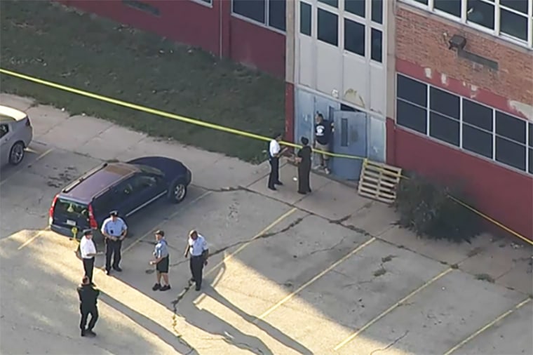 Officials investigate a fatal shooting near Roxborough High School, in Philadelphia, on Sept. 27.