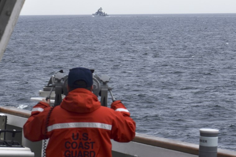 A Coast Guard crew member observes a foreign vessel in the Bering Sea on Sept. 19. 