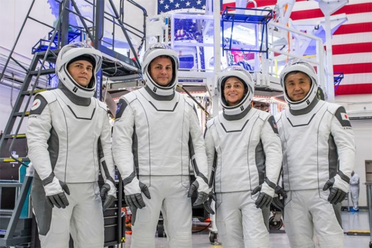 The four members of the SpaceX Crew-5 mission pose for a portrait in their Crew Dragon flight suits at SpaceX headquarters in Hawthorne, Calif. From left are Mission Specialist Anna Kikina from Roscosmos; Pilot Josh Cassada and Commander Nicole Aunapu Mann, both from NASA; and Mission Specialist Koichi Wakata from the Japan Aerospace Exploration Agency (JAXA). 