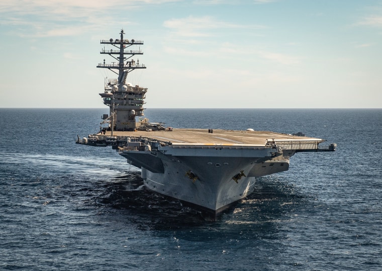 The aircraft carrier USS Nimitz (CVN 68) steams forward in the Pacific Ocean on March 12, 2022.