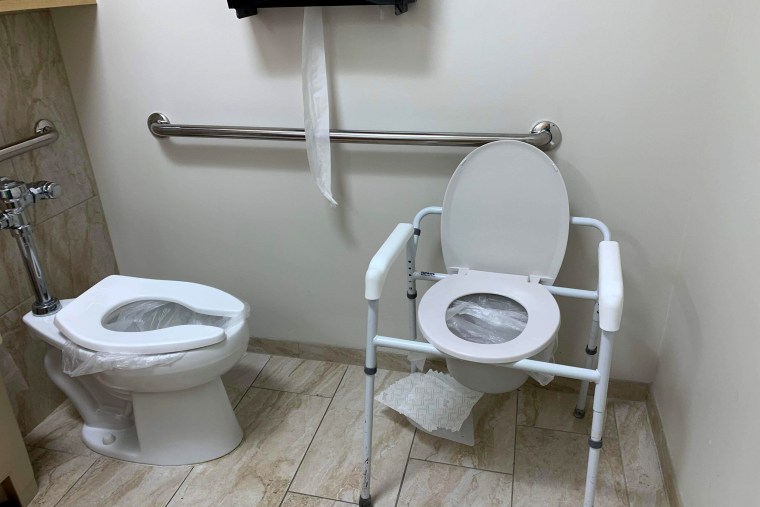 Plastic bags are used in a bathroom at Health Park Medical Center bathroom due to no running water in Fort Myers, Fla.