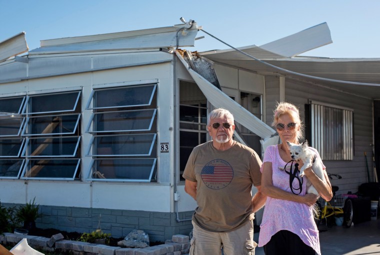 Ken and Barbara Williams outside their home in the Poinsettia Mobile Home Park.