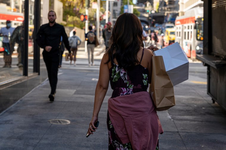 A shopper carries bags in San Francisco