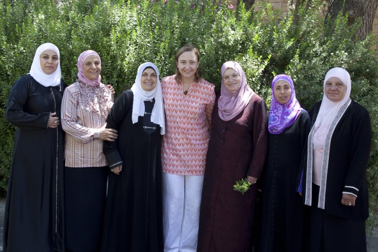 After her experience with cancer, Carolyn Taylor founded Global Focus on Cancer to help women with cancer in other countries get peer-to-peer support. She's pictured with the Sunshine Group, the only such group in the West Bank.
