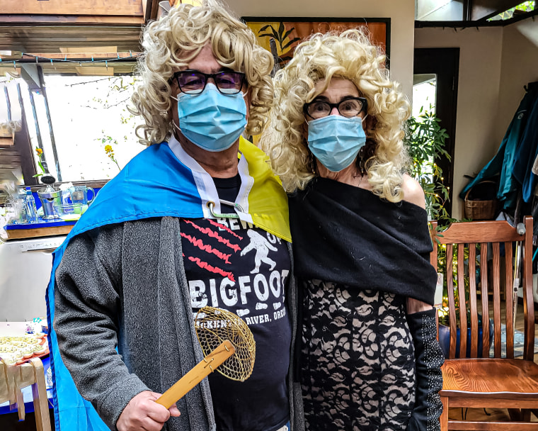 The author and her husband in blond wigs. They dressed up in fun to celebrate the life of a friend after her recent cancer diagnosis.

