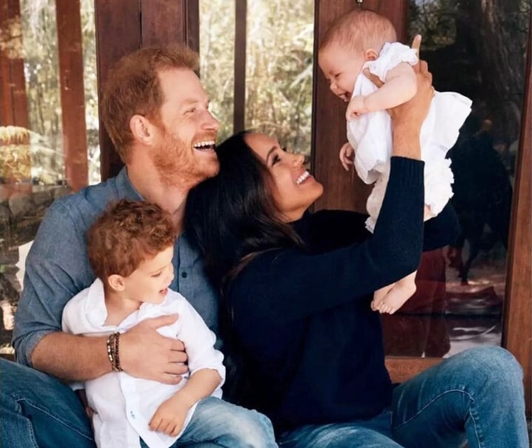 Prince Harry and Meghan Markle with their family.