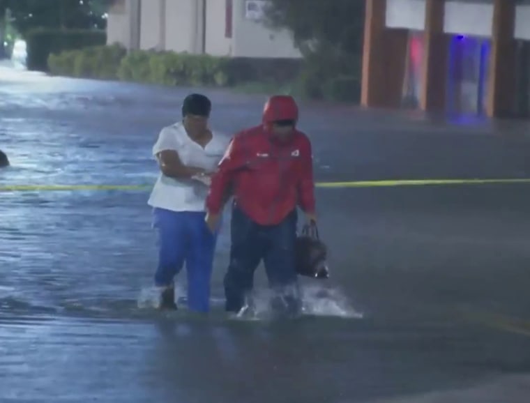 WESH 2 News reporter Tony Atkins saves a nurse from flood waters caused by Hurricane Ian.