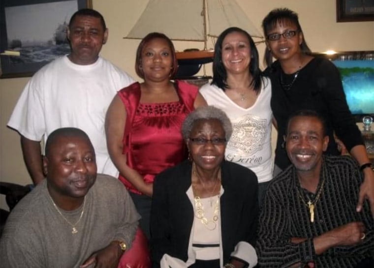 Hannah Ford with six of her 11 children. Erica Woodberry is pictured in the red dress. 