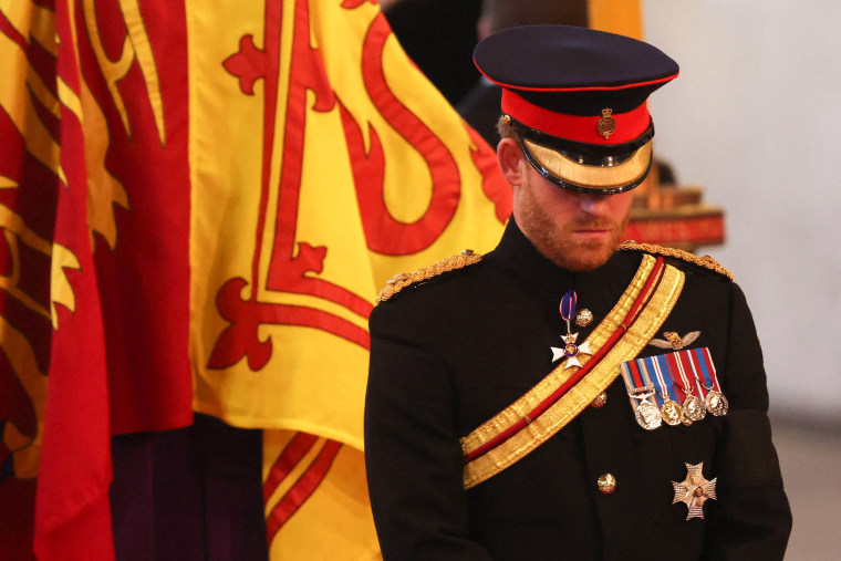 Britain's Prince Harry (R), Duke of Sussex, mount a vigil around the coffin of Queen Elizabeth II, draped in the Royal Standard with the Imperial State Crown and the Sovereign's orb and sceptre, lying in state on the catafalque in Westminster Hall, at the