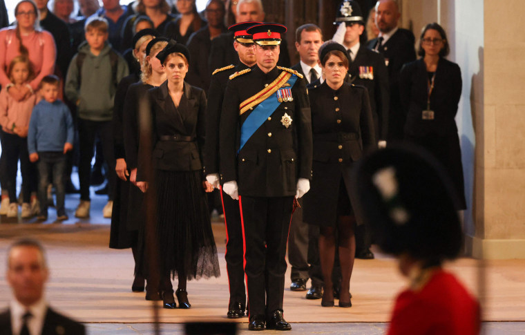 (front row L to R) Britain's Princess Beatrice of York, Britain's Prince Harry, Duke of Sussex, Britain's Prince William, Prince of Wales and Britain's Princess Eugenie of York arrive to mount a vigil around the coffin of Queen Elizabeth II, draped in the