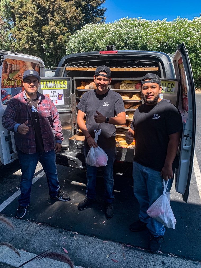 Ernesto Botello of Zeledon’s Bakery on Wheels with a pair of happy customers. 