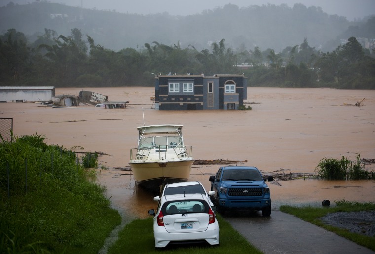 A home is submerged in floodwaters caused by Hurricane Fiona in Cayey, Puerto Rico.