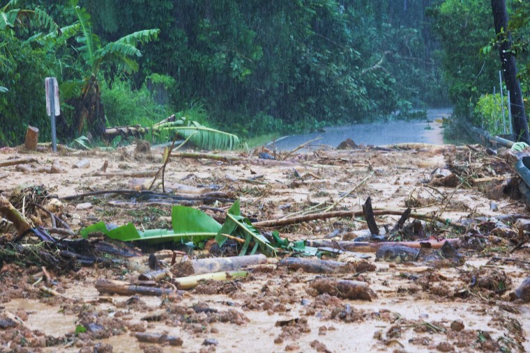 A road is blocked by a mudslide caused by Hurricane Fiona in Cayey, Puerto Rico. 