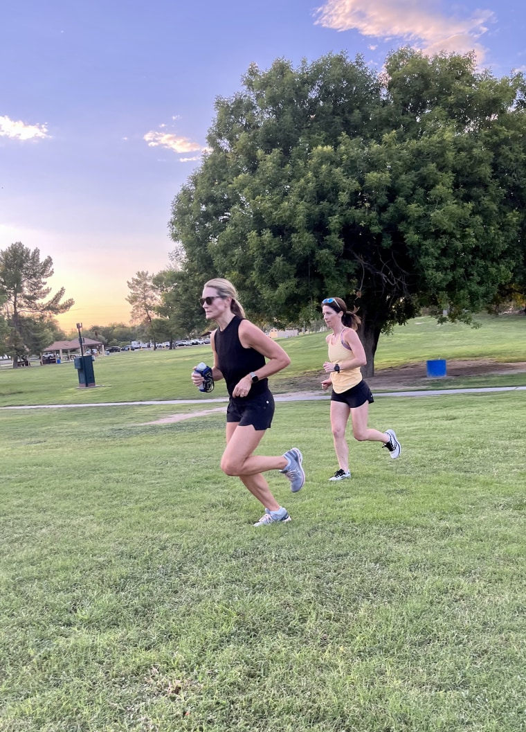 Keep your elbow bent at 90 degrees, like these participants in a Run Tucson running form session.