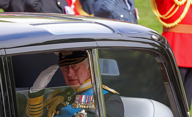 King Charles III salutes during Queen Elizabeth II's state funeral.