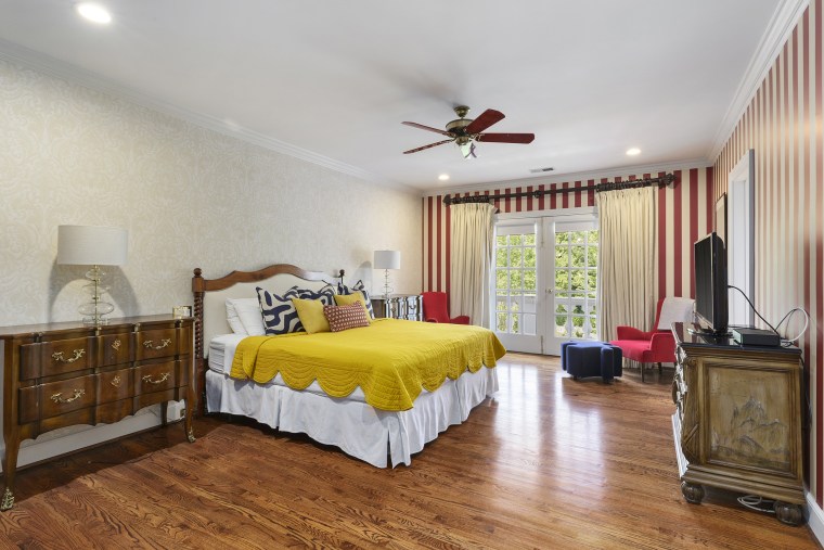 Another bedroom with striped accent walls.