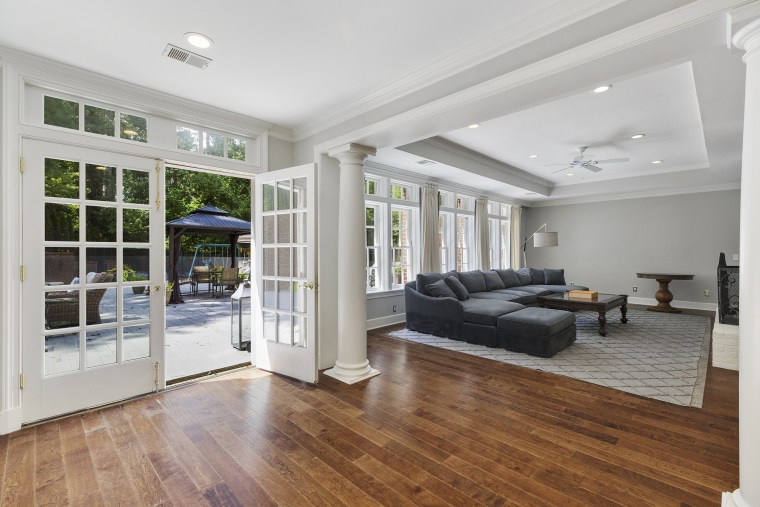 The living space opens to the outdoors through French doors.