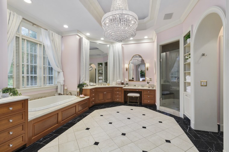 A chandelier hangs above one of the mansion's many bathrooms.