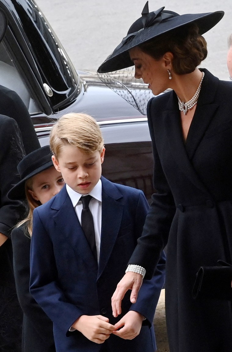 Kate Middleton, Princess of Wales, with Princess Charlotte and Prince George at Queen Elizabeth's funeral