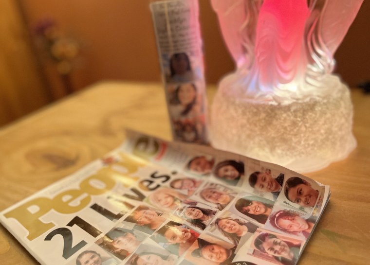A memorial candle for Jackie and the cover of PEOPLE, kept in Julissa's home.