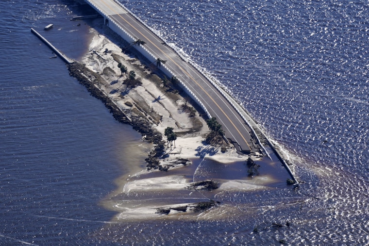 The causeway leading to Sanibel Island from Fort Myers, Fla., is shown damaged after Hurricane Ian passed through the area, Friday.